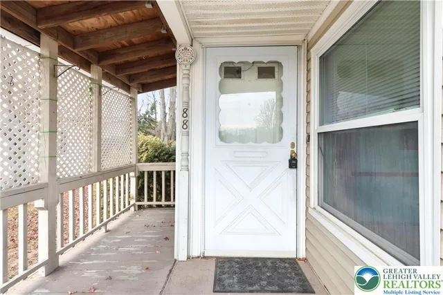 a view of a balcony with wooden floor