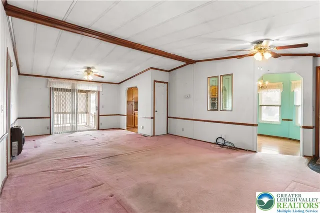 a dining room with a table and chairs
