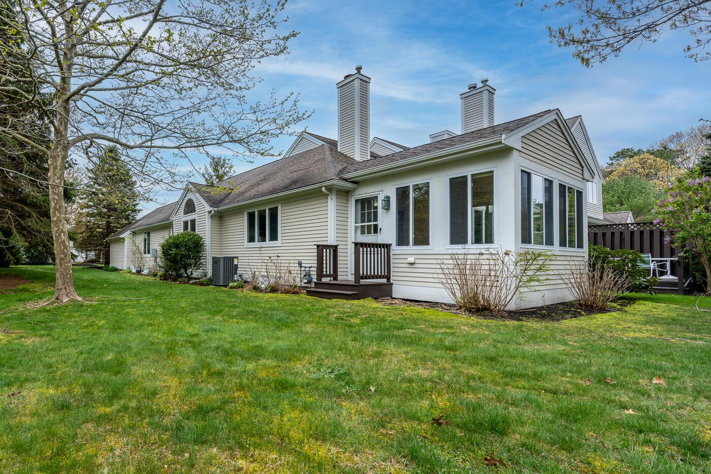 9 Executive Drive Mashpee, MA 02649 - Photo 3 of 15 a house view with a garden space