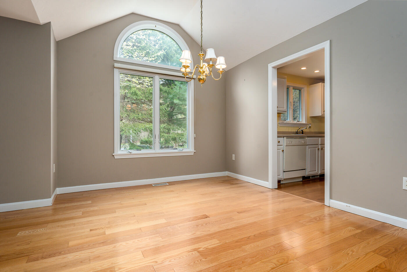 9 Executive Drive Mashpee, MA 02649 - Photo 7 of 15 wooden floor in an empty room with a window