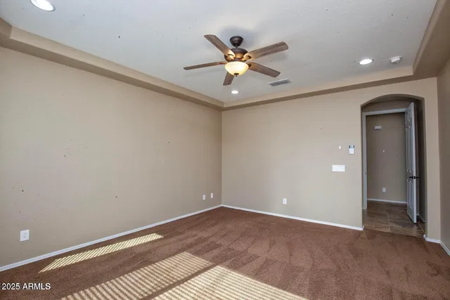 a view of an empty room with a chandelier