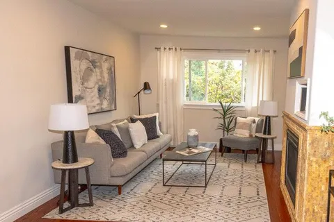 a living room with furniture and a table