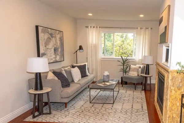a living room with furniture and a table