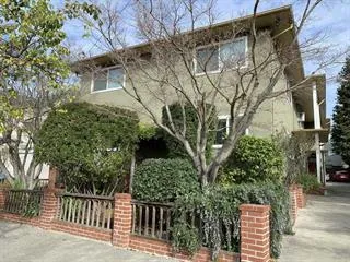 a view of a house with a tree