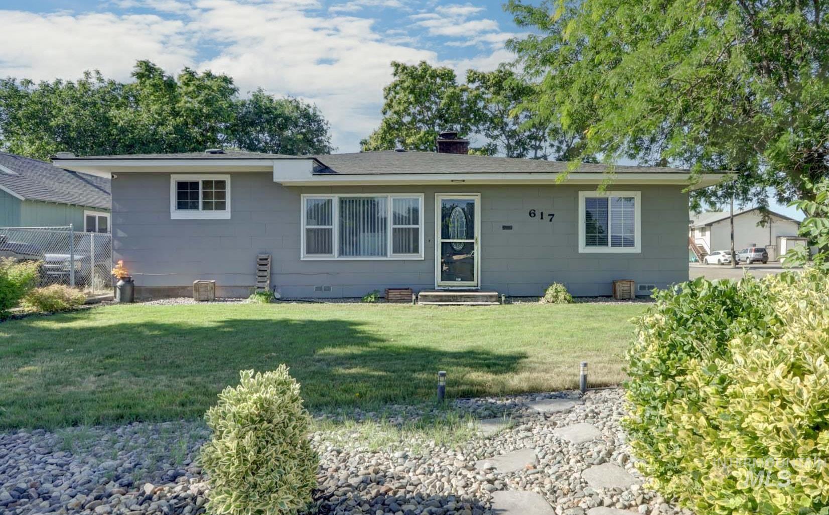 Ranch-style house featuring a chimney