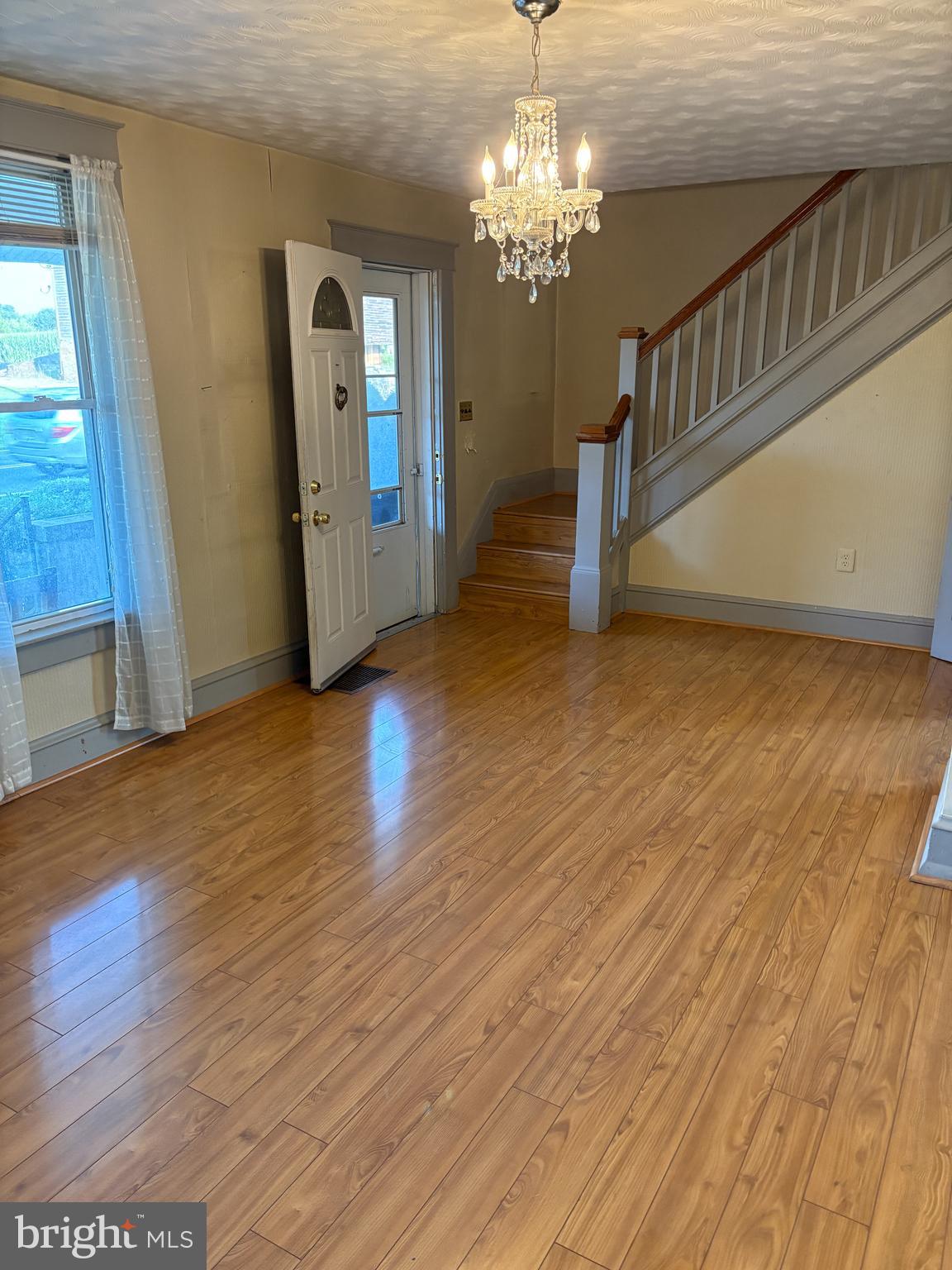 1906 Hanover Pike Hampstead, MD 21074 - Photo 3 of 45 a view of a livingroom with wooden floor and stairs