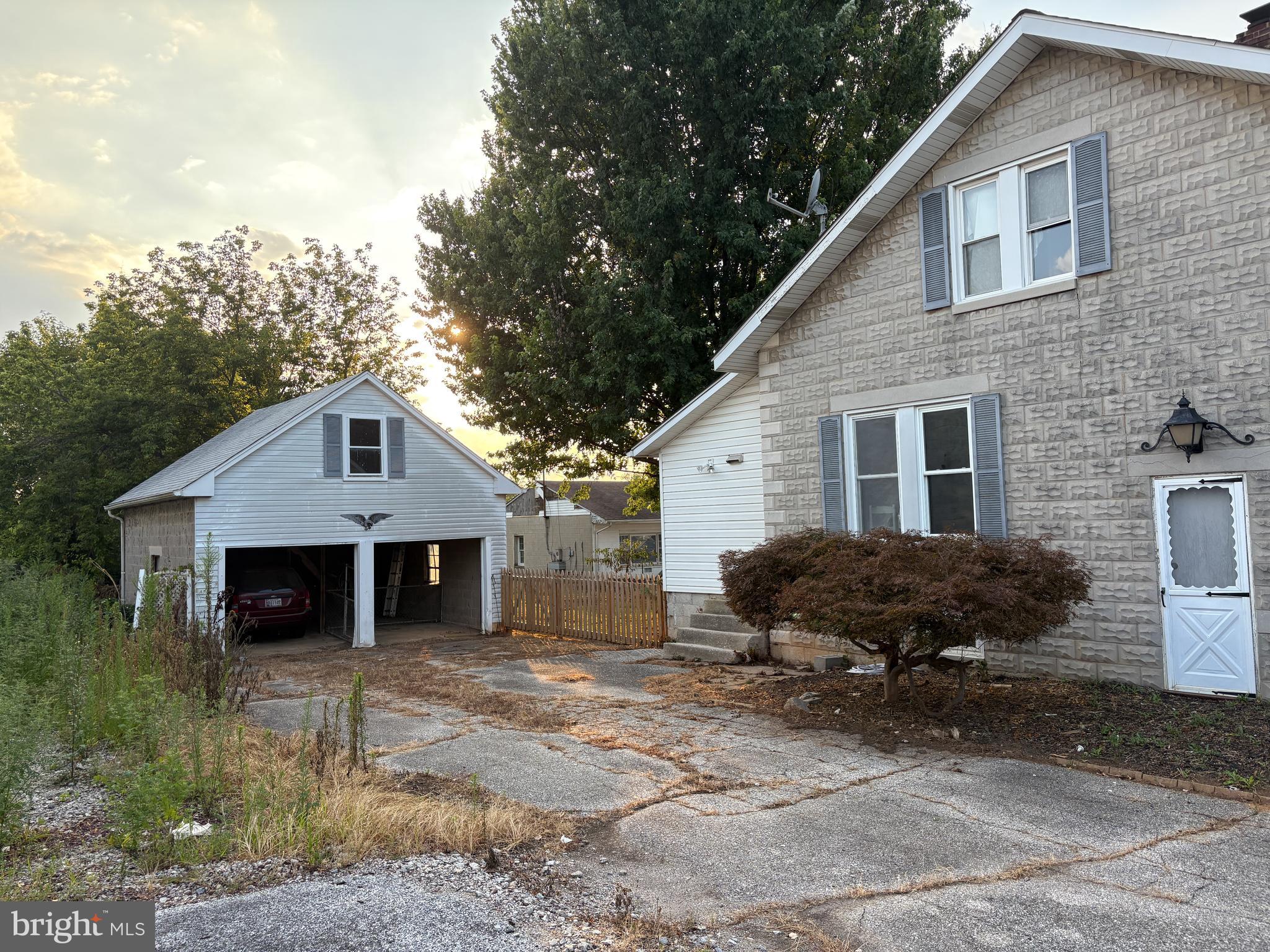 1906 Hanover Pike Hampstead, MD 21074 - Photo 35 of 45 a front view of a house with a yard and parking space