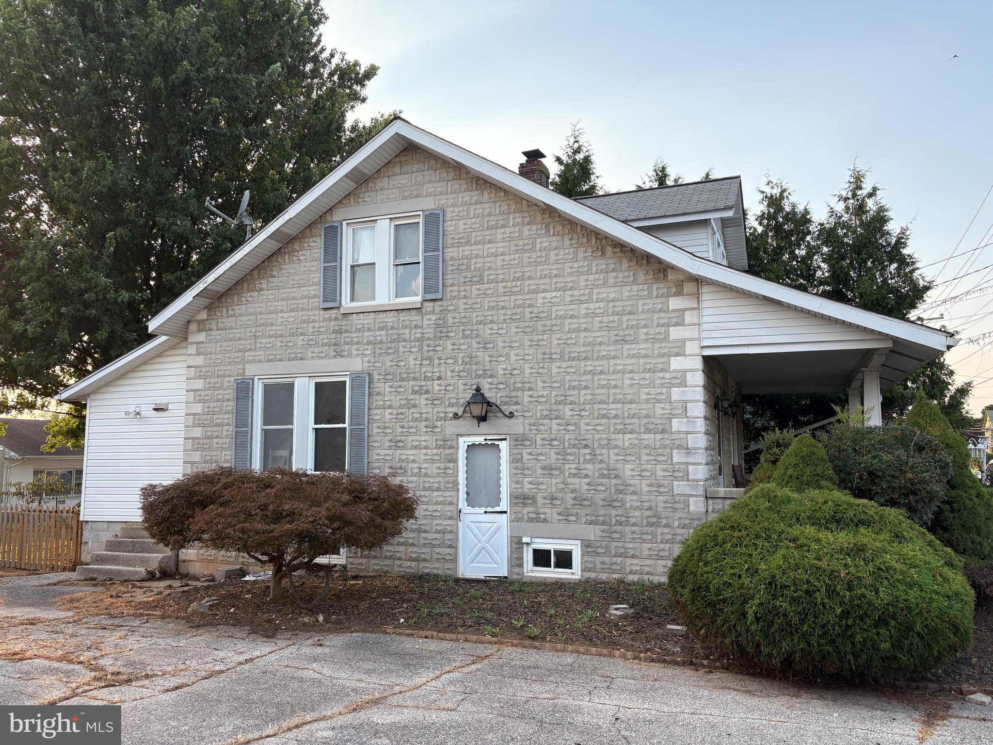 1906 Hanover Pike Hampstead, MD 21074 - Photo 36 of 45 a view of a house with a yard plants and large tree