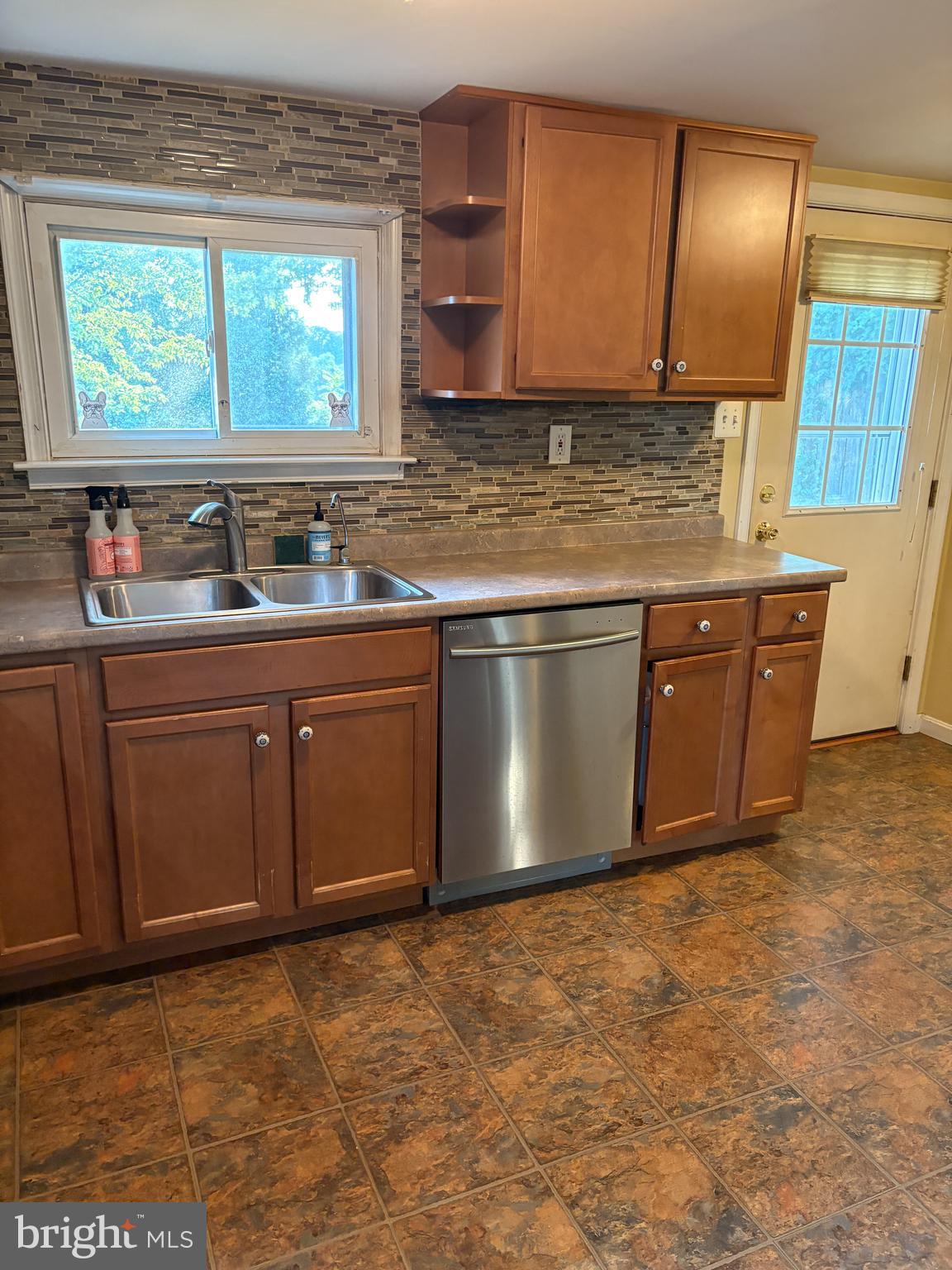 1906 Hanover Pike Hampstead, MD 21074 - Photo 6 of 45 a kitchen with stainless steel appliances granite countertop a sink stove and cabinets