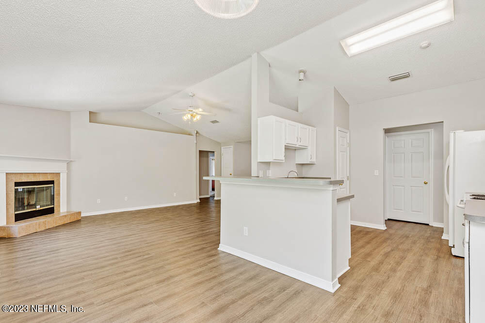 1399 Guardian Drive Jacksonville, FL 32221 - Photo 11 of 29 a view of kitchen view wooden floor and electronic appliances
