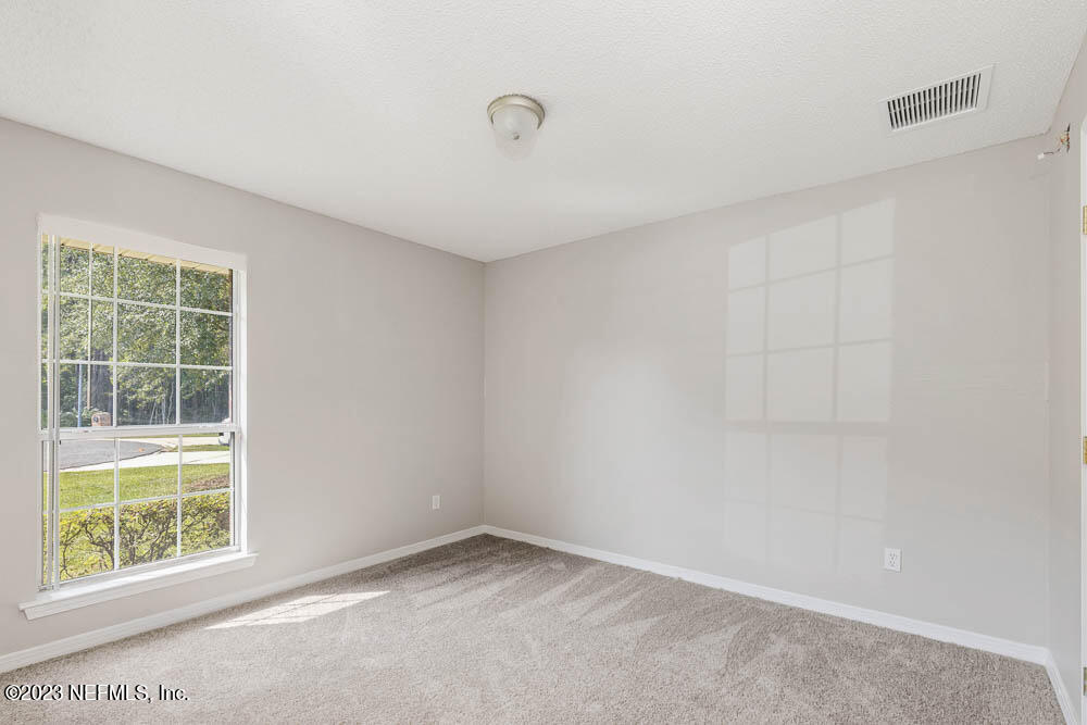 1399 Guardian Drive Jacksonville, FL 32221 - Photo 16 of 29 an empty room with a window