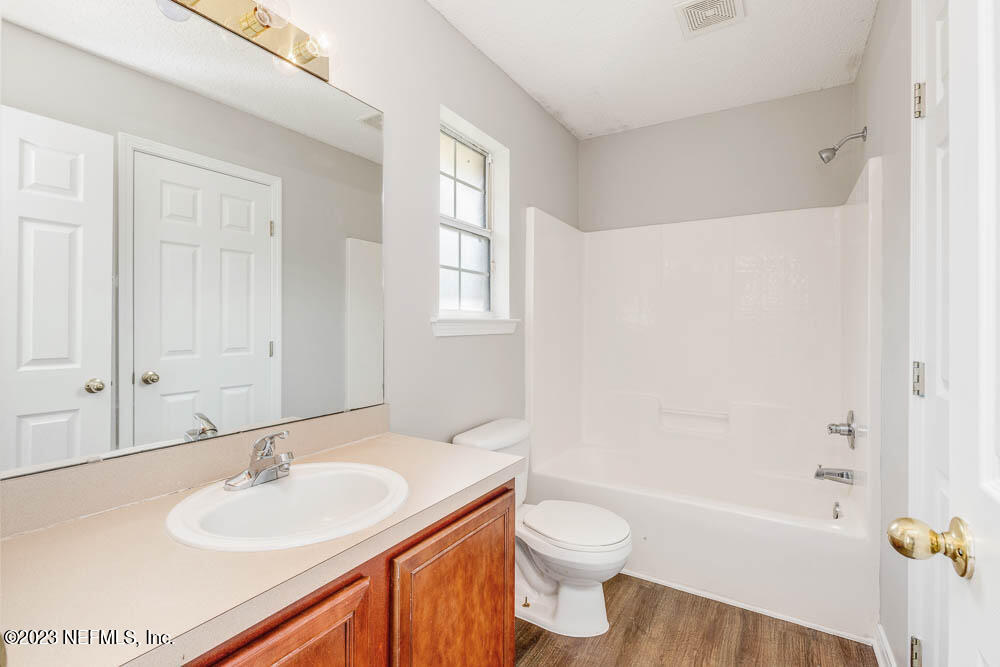 1399 Guardian Drive Jacksonville, FL 32221 - Photo 17 of 29 a bathroom with a sink and a mirror
