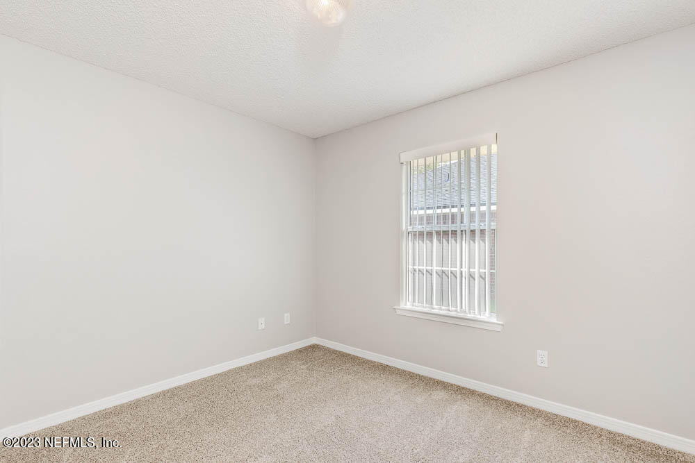 1399 Guardian Drive Jacksonville, FL 32221 - Photo 18 of 29 a view of an empty room with a window