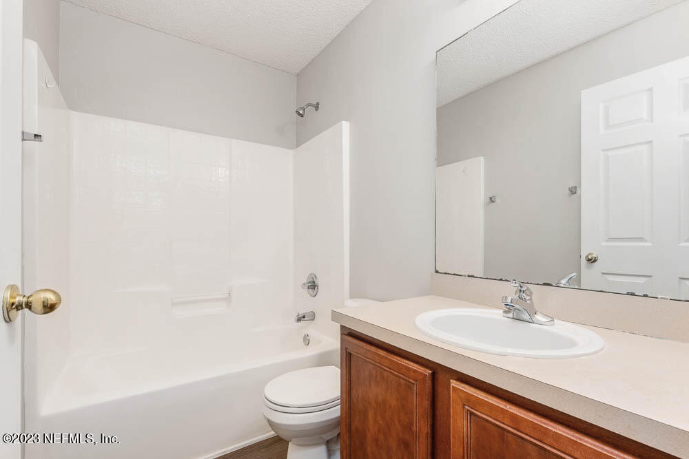 1399 Guardian Drive Jacksonville, FL 32221 - Photo 20 of 29 a bathroom with a sink toilet and shower