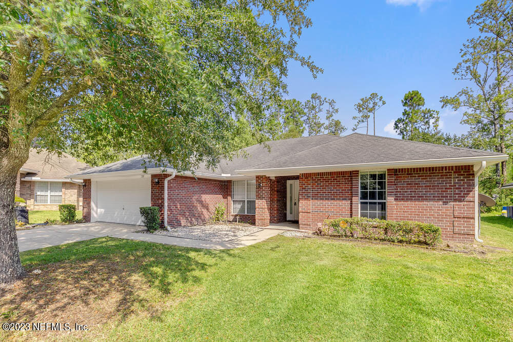 1399 Guardian Drive Jacksonville, FL 32221 - Photo 3 of 29 a view of a house with pool and a yard