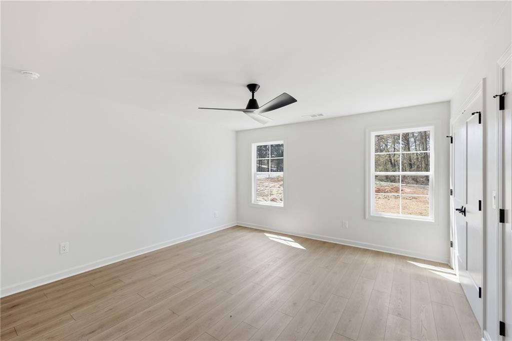1121 Riverside Terrace Gainesville, GA 30501 - Photo 30 of 39 wooden floor in an empty room with a window