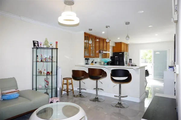 a kitchen with a dining table and chairs