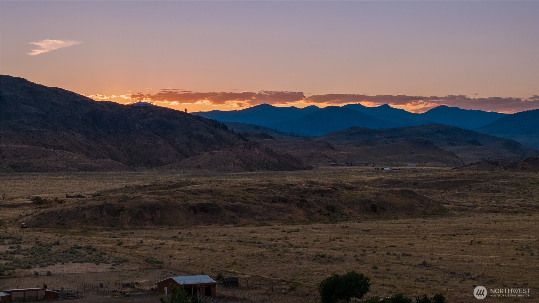 111 Johnson Creek Road Omak, WA 98841 - Photo 12 of 37 a view of a lake with sunset in background
