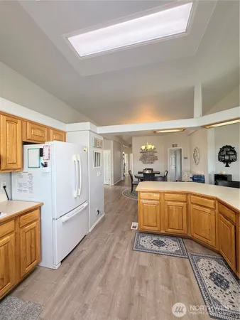 a large kitchen with a lot of counter space and appliances