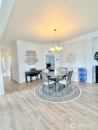 a view of a dining room and a table and chairs