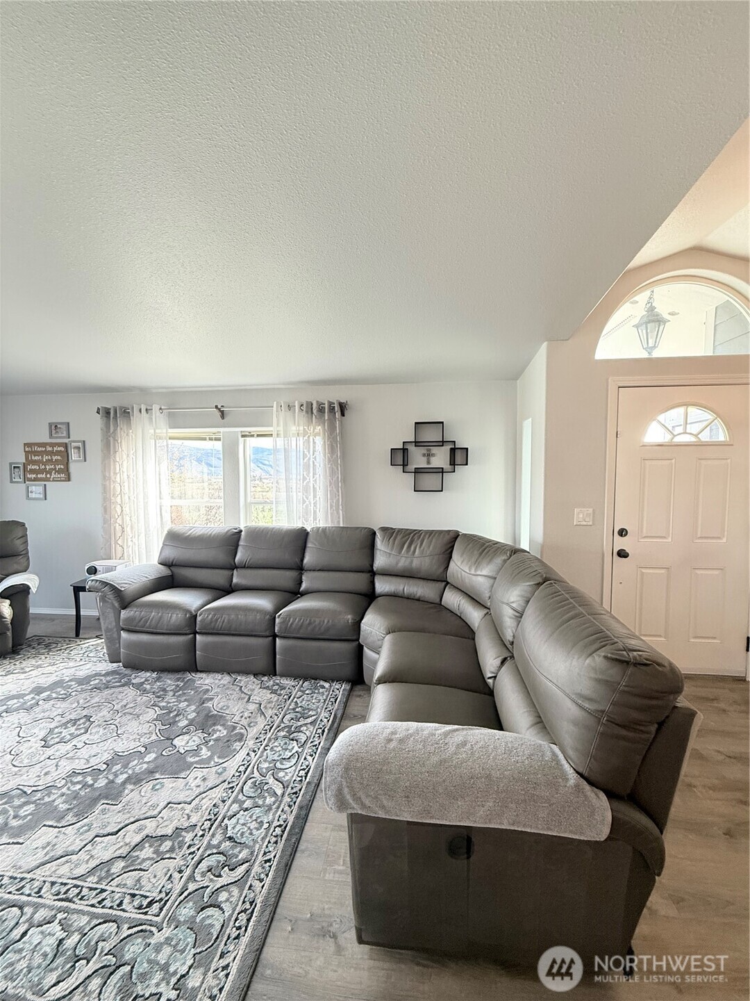 111 Johnson Creek Road Omak, WA 98841 - Photo 23 of 37 a living room with furniture and a large window