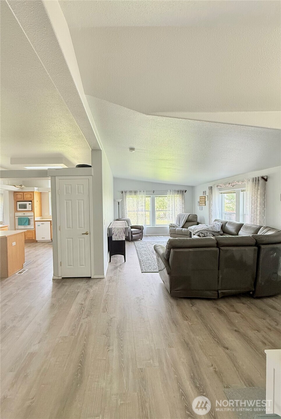 111 Johnson Creek Road Omak, WA 98841 - Photo 25 of 37 a living room with furniture and wooden floor
