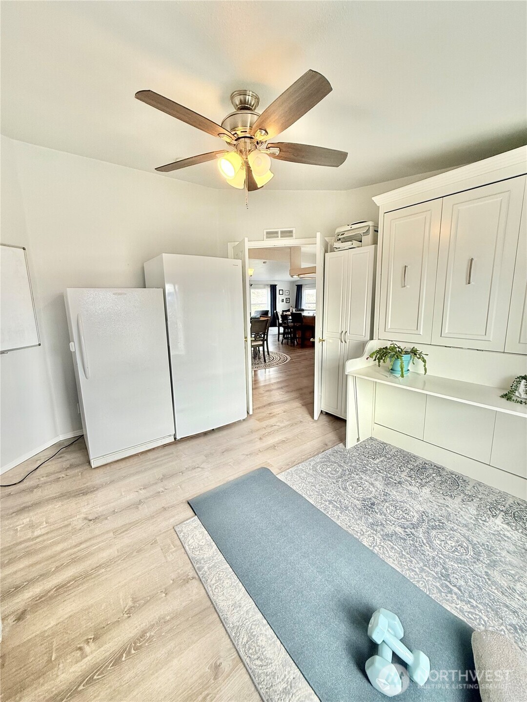 111 Johnson Creek Road Omak, WA 98841 - Photo 27 of 37 a living room with a couch and a chandelier