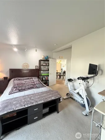 a bedroom with bed and window