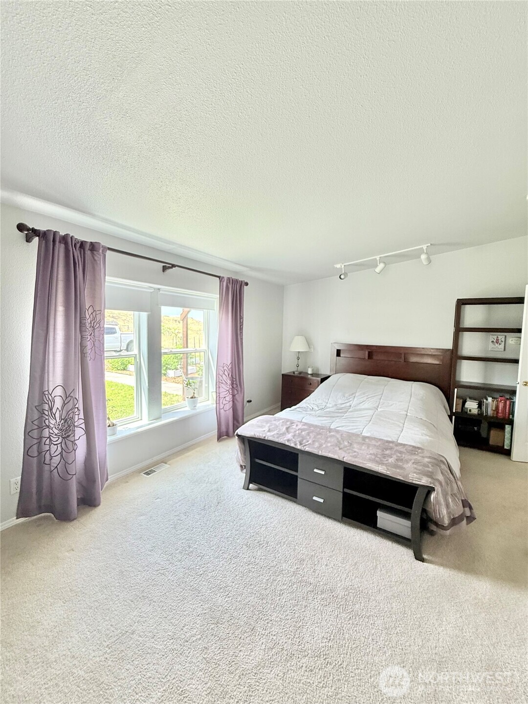 111 Johnson Creek Road Omak, WA 98841 - Photo 30 of 37 a spacious bedroom with a bed and a cabinets