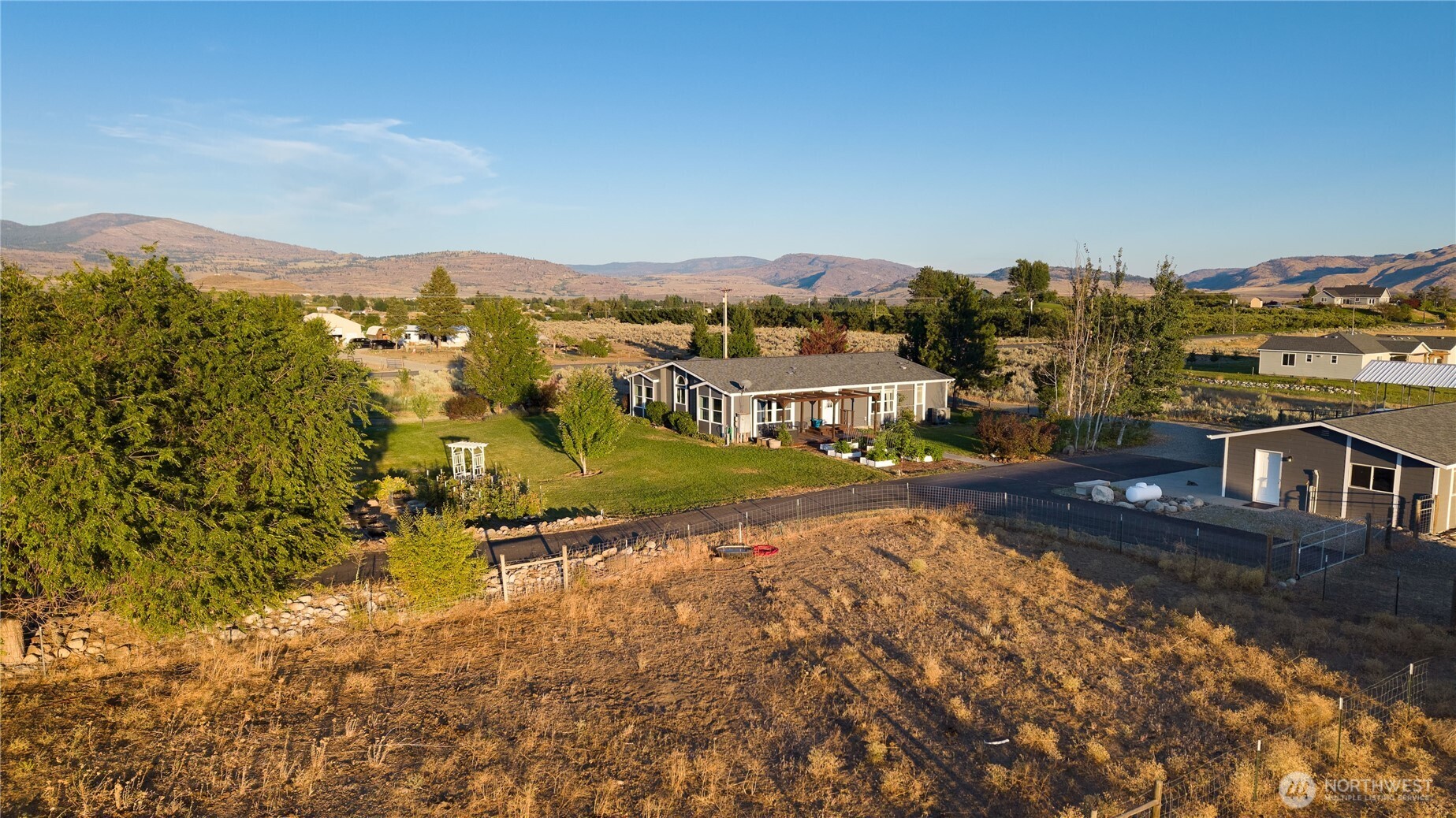 111 Johnson Creek Road Omak, WA 98841 - Photo 4 of 37 an aerial view of residential houses with outdoor space and trees
