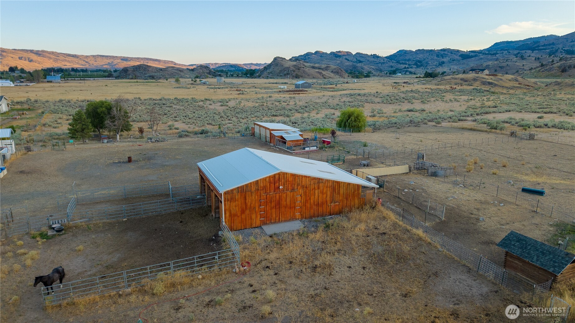 111 Johnson Creek Road Omak, WA 98841 - Photo 10 of 37 a view of a lake with mountains in the background