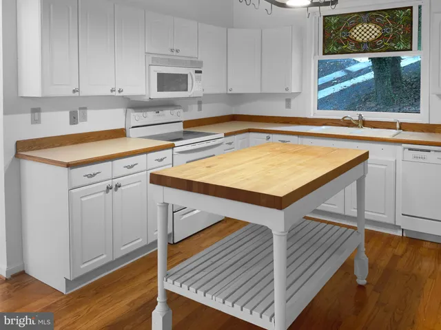 a kitchen that has a sink and a stove