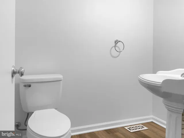 a bathroom with a toilet and a sink