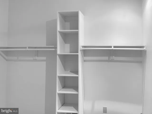 a close view of closet and wooden floor