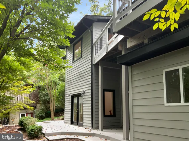 a view of a house with a tree