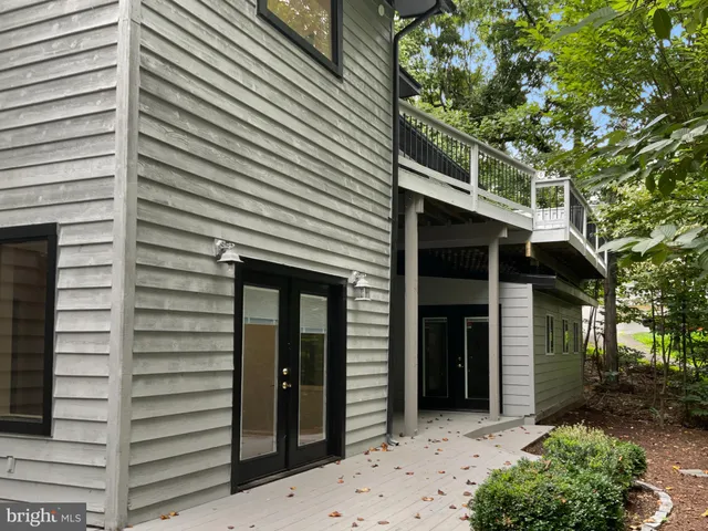 a view of a house with a tree