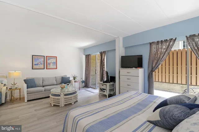 a bathroom with a toilet a sink and a mirror