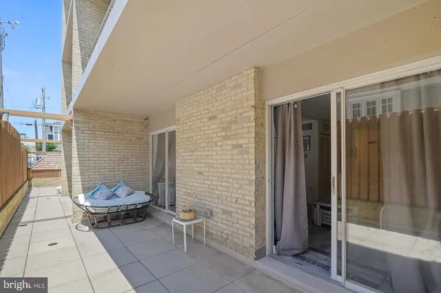 a view of a balcony with chairs