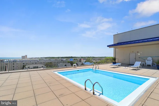a view of a city and swimming pool