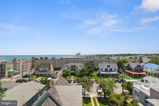 a view of cars parked in front of a building