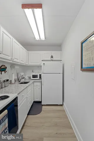 a kitchen with a stove and cabinets
