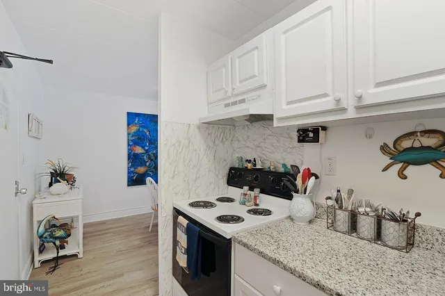 a workspace with furniture window and wooden floor