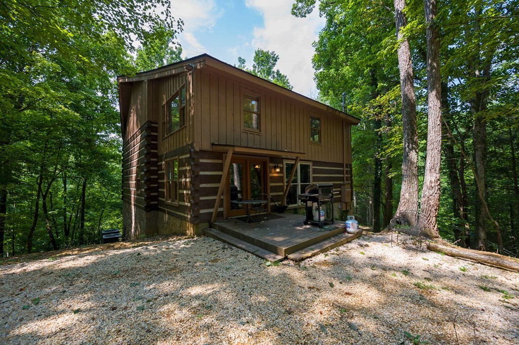 4296 Powdermill Estates Road Sevierville, TN 37876 - Photo 2 of 55 a view of a house with backyard and trees
