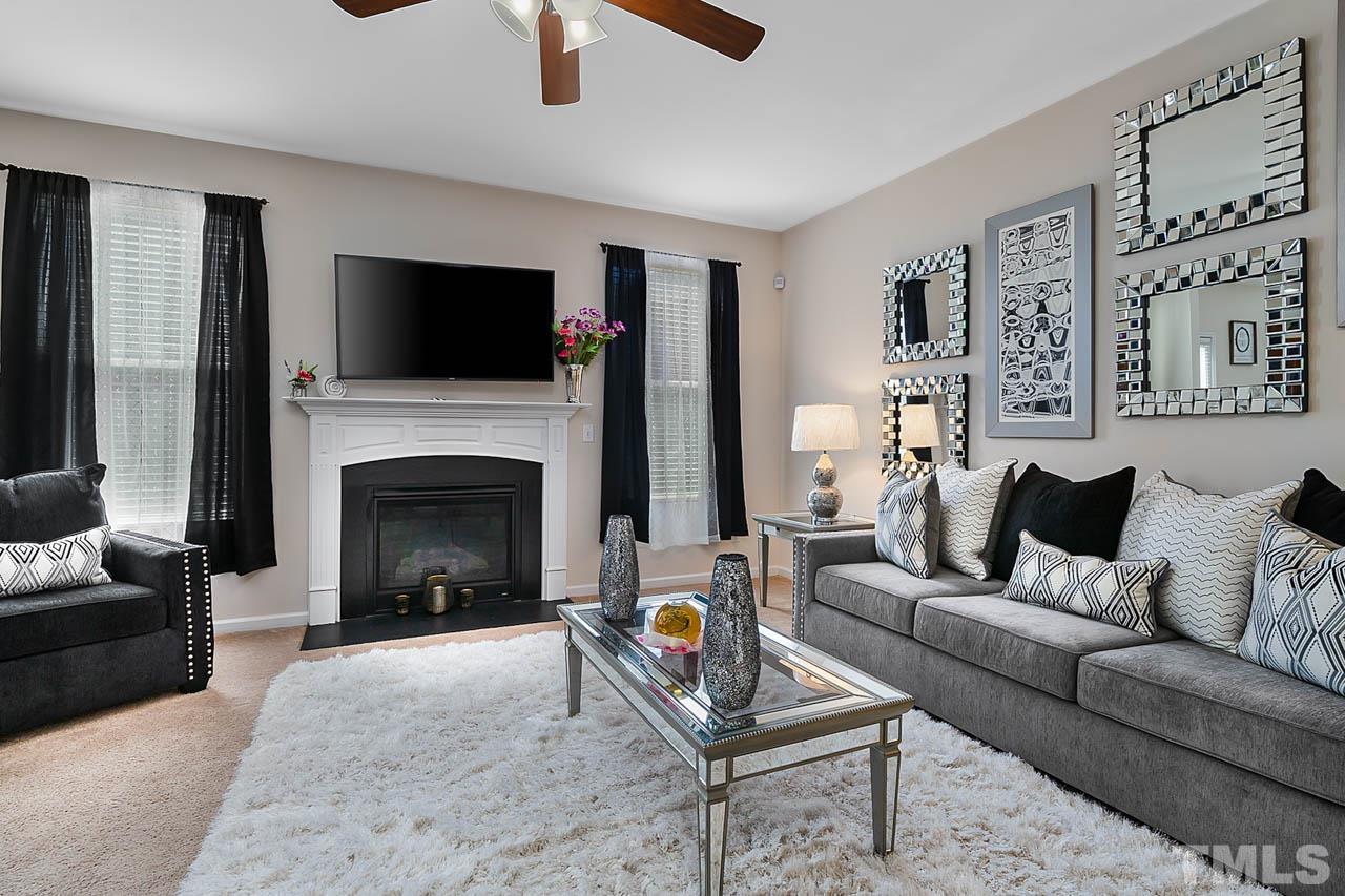 3540 Eastern Branch Road Raleigh, NC 27610 - Photo 14 of 35 a living room with furniture and a fireplace