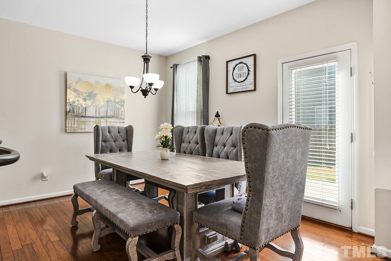 3540 Eastern Branch Road Raleigh, NC 27610 - Photo 17 of 35 a view of a dining room with furniture and wooden floor