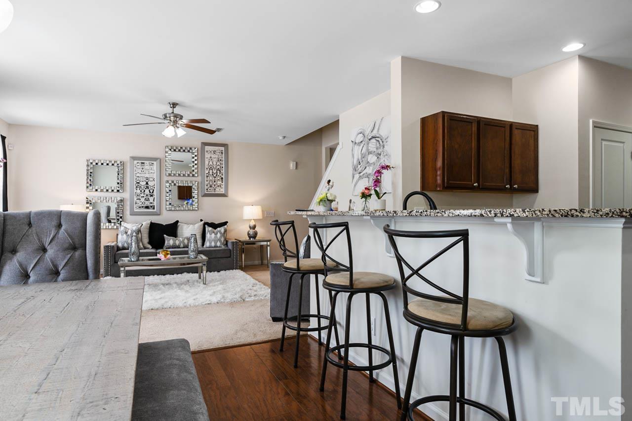 3540 Eastern Branch Road Raleigh, NC 27610 - Photo 19 of 35 a living room with fireplace furniture and a flat screen tv