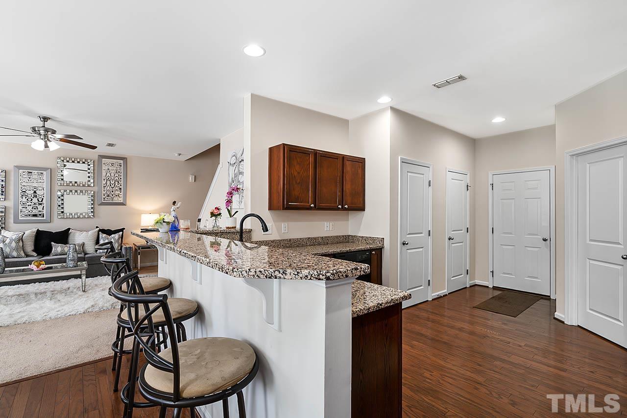 3540 Eastern Branch Road Raleigh, NC 27610 - Photo 20 of 35 a kitchen with stainless steel appliances granite countertop a stove and a sink