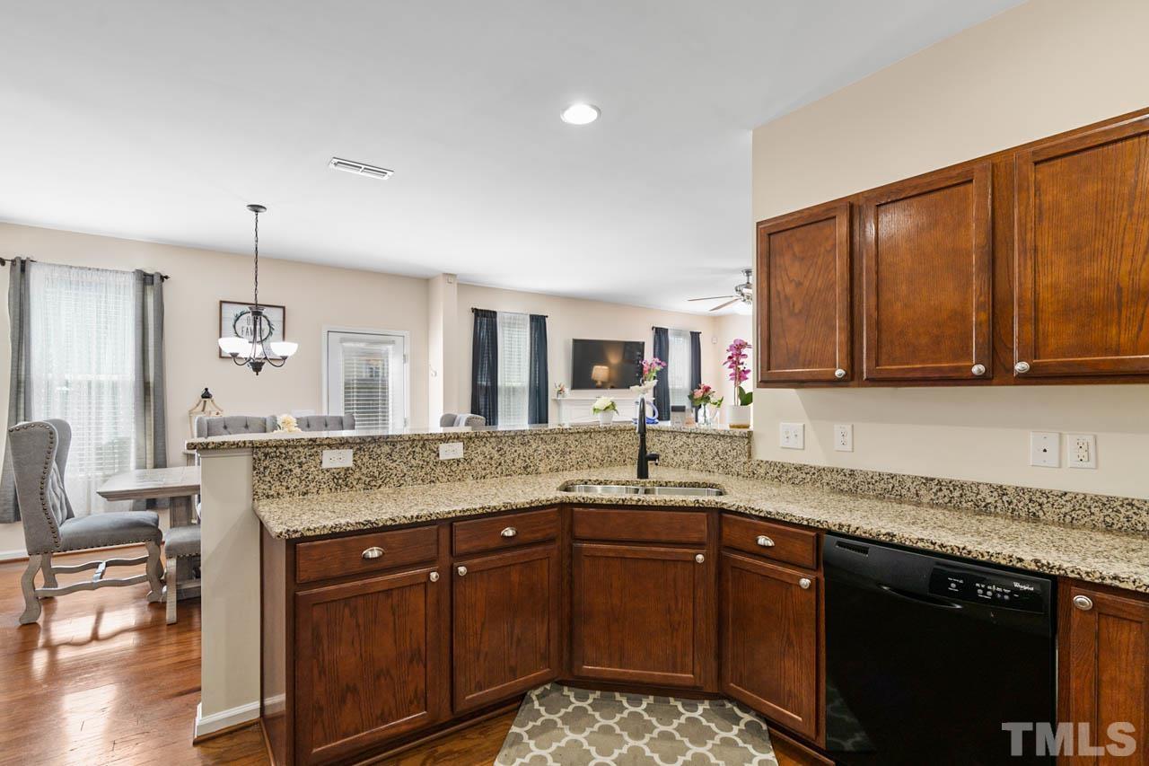 3540 Eastern Branch Road Raleigh, NC 27610 - Photo 24 of 35 a kitchen with granite countertop a sink and cabinets