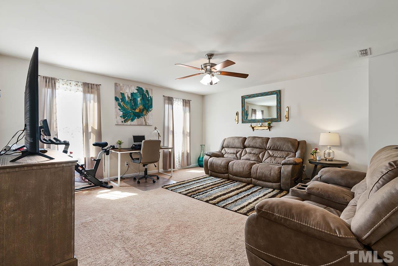 3540 Eastern Branch Road Raleigh, NC 27610 - Photo 26 of 35 a living room with furniture ceiling fan and a window