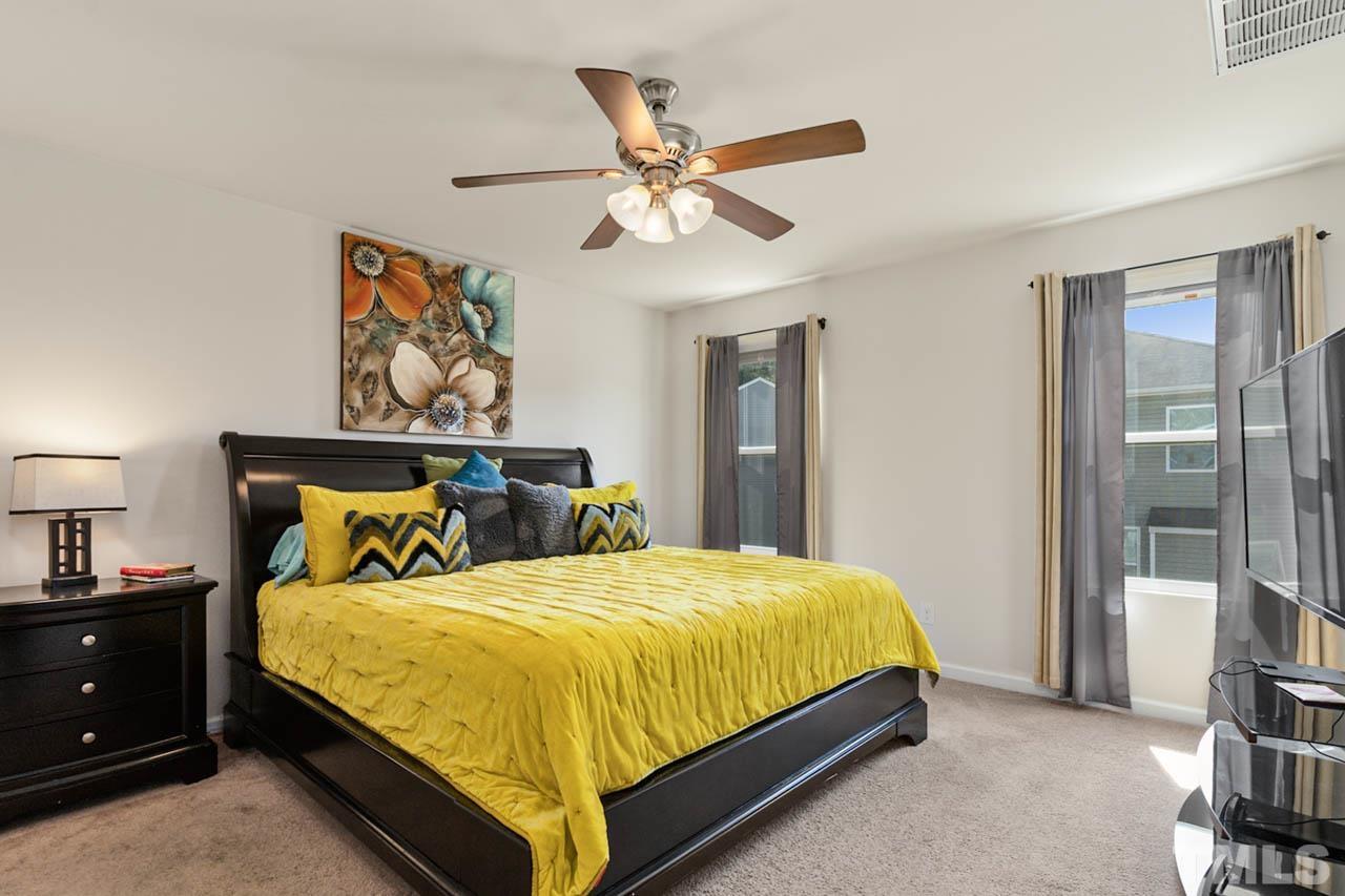 3540 Eastern Branch Road Raleigh, NC 27610 - Photo 31 of 35 a bedroom with a bed and window